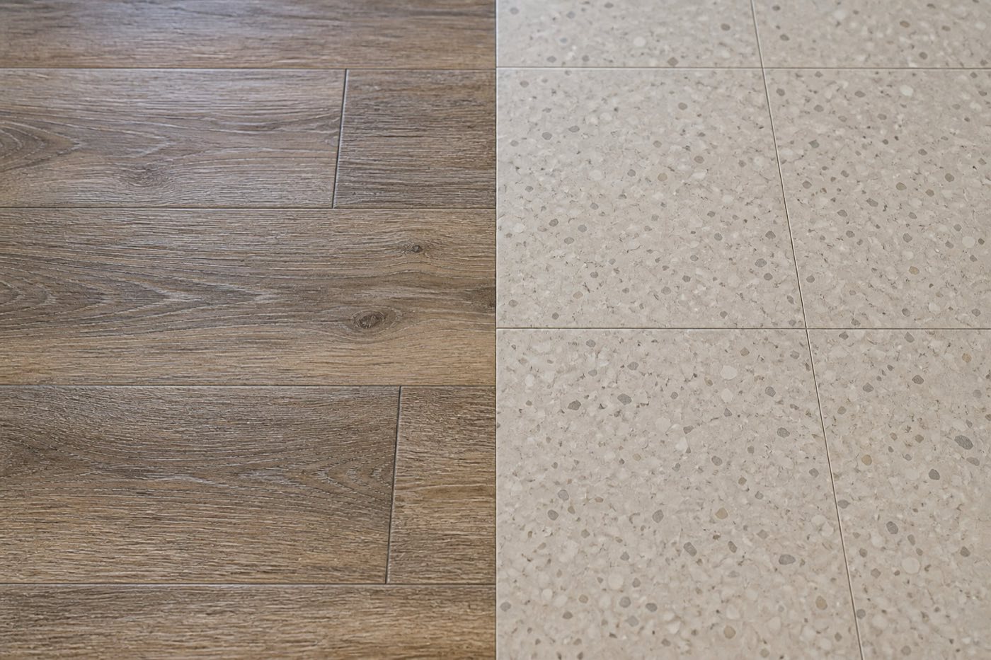 Side-by-side close-up of plank-format LVT and square speckled VCT